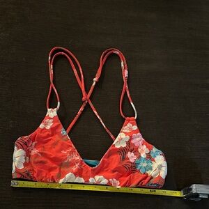 O’Neill reversible Teal/Red bikini top. No size tag. Either Small or Medium.
